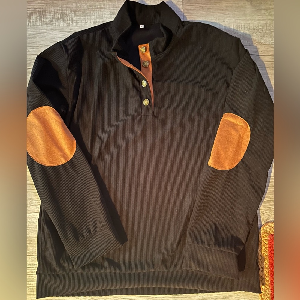 Collared black shirt Size L Black. Rust accents. 4 metal buttons. Worn once